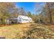 House exterior with a large backyard and shed at 75 Antioch Rd, Mcdonough, GA 30252