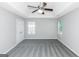 Large bedroom with gray carpet and ceiling fan at 30 Capeton Ct, Covington, GA 30016