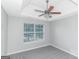 Bright bedroom with ceiling fan and window at 30 Capeton Ct, Covington, GA 30016