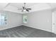 Spacious bedroom with gray carpet and ceiling fan at 30 Capeton Ct, Covington, GA 30016