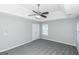 Primary bedroom with gray carpet and ceiling fan at 30 Capeton Ct, Covington, GA 30016