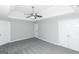 Spacious bedroom with ceiling fan and neutral carpeting at 30 Capeton Ct, Covington, GA 30016