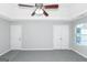 Primary bedroom with gray carpet and double door closet at 30 Capeton Ct, Covington, GA 30016