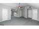 Spacious bonus room with high ceiling and carpet at 30 Capeton Ct, Covington, GA 30016