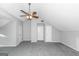 Bright bonus room with high ceiling and carpet at 30 Capeton Ct, Covington, GA 30016