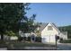 House exterior showcasing landscaping and a two-car garage at 30 Capeton Ct, Covington, GA 30016