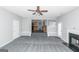 Open living room with kitchen view and fireplace at 30 Capeton Ct, Covington, GA 30016