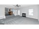 Living room with fireplace and view into kitchen at 30 Capeton Ct, Covington, GA 30016