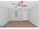 Bright bedroom with window and ceiling fan at 201 Christian Cir, Carrollton, GA 30116