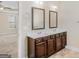 Double vanity bathroom with spacious countertop and mirrors at 1141 Abundance Dr, Locust Grove, GA 30248