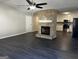 Living room with fireplace and laminate wood floors at 214 Oak Cir, Stockbridge, GA 30281