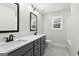Modern bathroom with double vanity and a tub at 278 Deer Creek Run # 3-12, Moreland, GA 30259