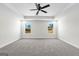 Spacious bedroom with grey carpet and two windows at 278 Deer Creek Run # 3-12, Moreland, GA 30259