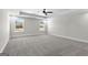 Bright bedroom with grey carpet and ceiling fan at 278 Deer Creek Run # 3-12, Moreland, GA 30259