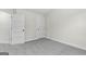 Empty bedroom with grey carpet and two doors at 278 Deer Creek Run # 3-12, Moreland, GA 30259