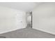 Spacious bedroom with grey carpet and two doors at 278 Deer Creek Run # 3-12, Moreland, GA 30259
