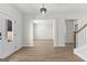 Bright entryway with luxury vinyl plank flooring, leading to the living room and staircase at 278 Deer Creek Run # 3-12, Moreland, GA 30259