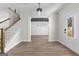 Entryway with hardwood floors, staircase, and view of dining room at 278 Deer Creek Run # 3-12, Moreland, GA 30259