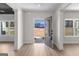 Open entryway with gray door, hardwood floors, and views of backyard at 278 Deer Creek Run # 3-12, Moreland, GA 30259
