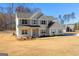 Two-story house with gray siding, white brick, and a large yard at 278 Deer Creek Run # 3-12, Moreland, GA 30259