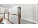 Upstairs hallway with hardwood flooring and railing at 278 Deer Creek Run # 3-12, Moreland, GA 30259