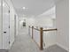 Upstairs hallway with carpeted floors and railing at 278 Deer Creek Run # 3-12, Moreland, GA 30259