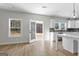 Bright kitchen with white cabinets, quartz countertops, and view to backyard at 278 Deer Creek Run # 3-12, Moreland, GA 30259
