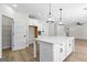 Modern kitchen with white cabinets, large island and walk-in pantry at 278 Deer Creek Run # 3-12, Moreland, GA 30259