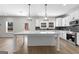 Large kitchen island with white quartz countertop and pendant lighting at 278 Deer Creek Run # 3-12, Moreland, GA 30259