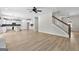 Open concept kitchen, living room, and staircase with hardwood floors at 278 Deer Creek Run # 3-12, Moreland, GA 30259
