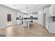 Modern kitchen with white cabinets, island, and stainless steel appliances at 278 Deer Creek Run # 3-12, Moreland, GA 30259