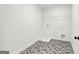 Laundry room with herringbone floor and shelving at 278 Deer Creek Run # 3-12, Moreland, GA 30259