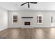 Bright living room featuring a fireplace and hardwood floors at 278 Deer Creek Run # 3-12, Moreland, GA 30259