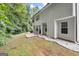 Private backyard with patio and wooded area at 427 Blackbird Way, Hampton, GA 30228