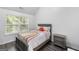 Bright bedroom with a double bed and window at 427 Blackbird Way, Hampton, GA 30228