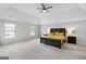 Main bedroom with carpeted floors and plenty of natural light at 427 Blackbird Way, Hampton, GA 30228