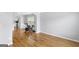 Dining area with hardwood floors and view into kitchen at 427 Blackbird Way, Hampton, GA 30228