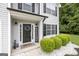 Inviting front entrance with a black door, wreath, and welcome sign at 427 Blackbird Way, Hampton, GA 30228