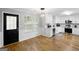 Bright eat-in kitchen with white cabinets and stainless steel appliances at 427 Blackbird Way, Hampton, GA 30228