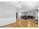 Spacious living room with hardwood floors and a comfortable sectional sofa at 427 Blackbird Way, Hampton, GA 30228