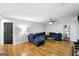 Relaxing living room featuring hardwood floors and a sectional sofa at 427 Blackbird Way, Hampton, GA 30228