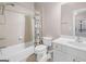 Clean bathroom with shower/tub combo and white vanity at 500 Poplar Creek Xing, Canton, GA 30114