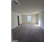 Large bedroom with carpeted floors and a window with blinds at 552 Moline Way, Locust Grove, GA 30248