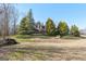 Landscaped yard with a two-story house in the background at 811 Somersby Dr, Dallas, GA 30157