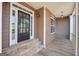 Front porch with a black door and wooden flooring at 811 Somersby Dr, Dallas, GA 30157