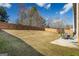 Large backyard with wooden fence, trampoline, and patio at 3120 Jackson Creek Dr, Stockbridge, GA 30281