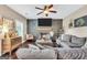 Living area featuring a sectional sofa, fireplace, and dark gray shiplap wall at 540 Deadwood Trl, Locust Grove, GA 30248