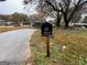 House exterior featuring a driveway and mailbox at 8819 Leafwood Ct, Riverdale, GA 30274