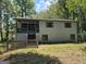 Ranch-style home with carport and deck at 115 Parkland Dr, Stockbridge, GA 30281