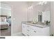 Bathroom with vanity and view into bedroom at 5158 Noble Village Way # 35, Lilburn, GA 30047